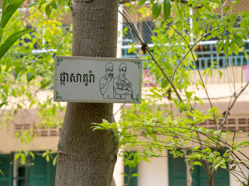 A sign in Cambodian Sign Language helps make the playground at a DEEP-supported school more accessible and welcoming for children with disabilities.