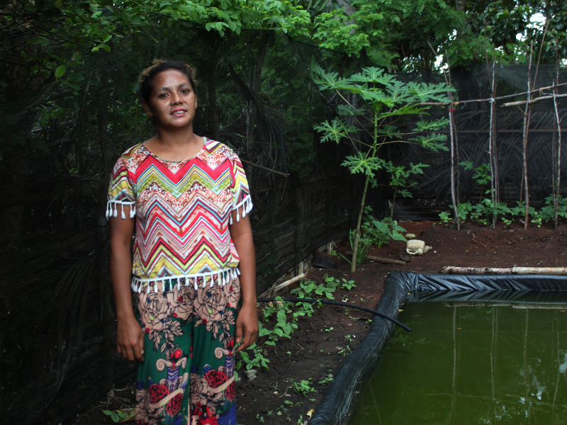Alcina Pinto, who grows leafy greens, water spinach, balsam pears, and eggplants on her farm.