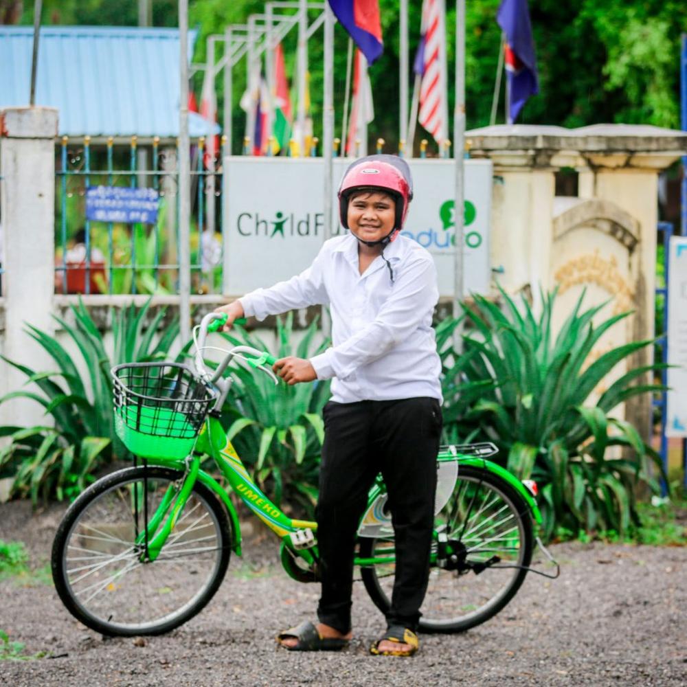 New wheels: Prasak, age 14, has a new bike and helmet from ChildFund Cambodia that's helping him to get to school safer and faster. "I'm happy to have the bike because I’m not late to school anymore and I’m not exhausted from walking,” he said.