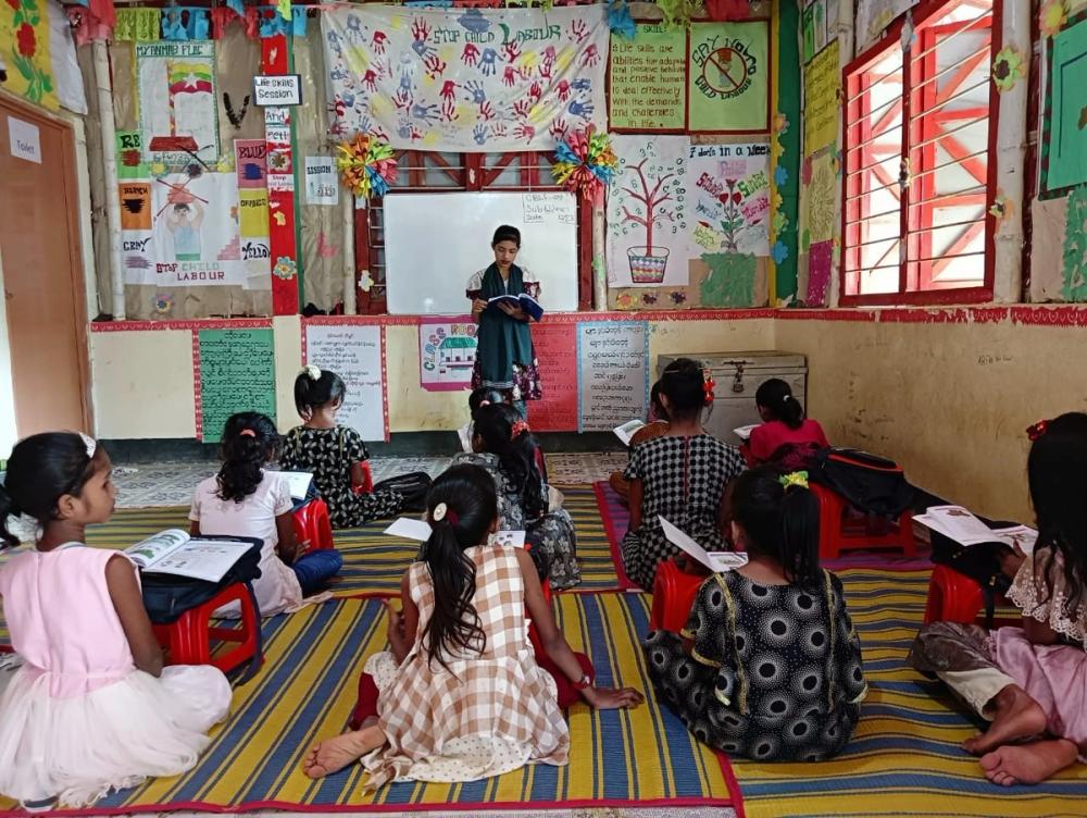 Lily, pictured at the head of the classroom, leads a discussion about menstrual hygiene and management. (ChildFund Australia) Source: ChildFund Australia