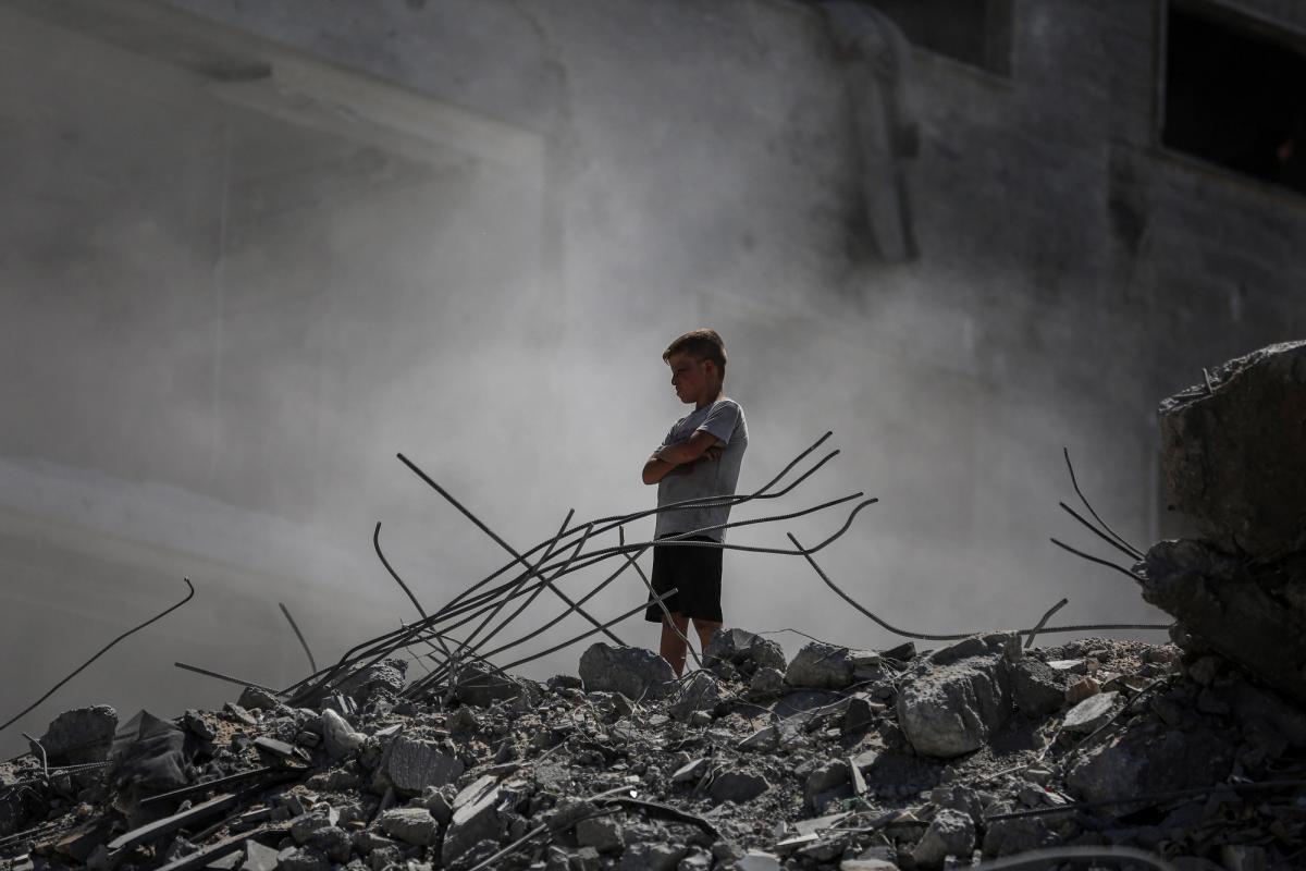 How many children have died in Gaza – grieving children amid destroyed home