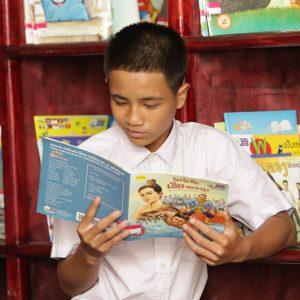 Jack reading a book in the reading room.