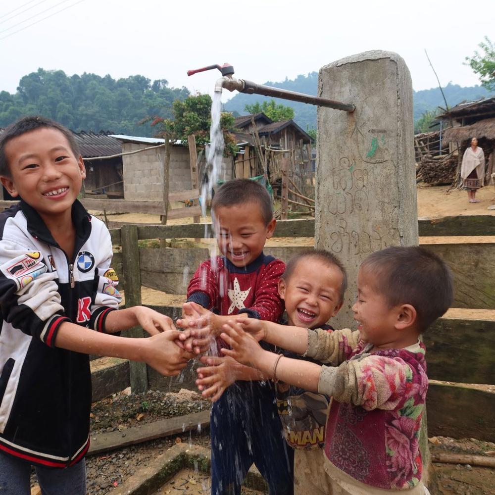 Children in Kankham's village, in remote Laos, enjoy clean, running water in their community for the first time.