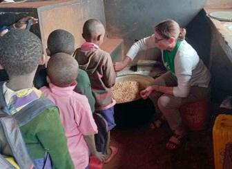 Sarah helping in the kitchen at a school in Kenya.