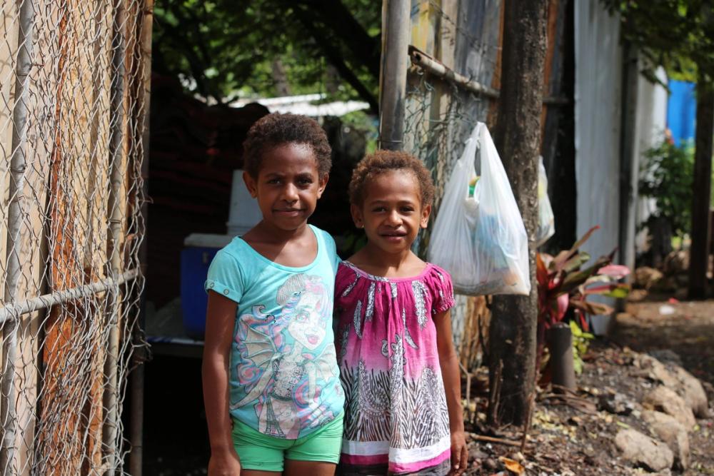 Jenny (right) with her friend in PNG.