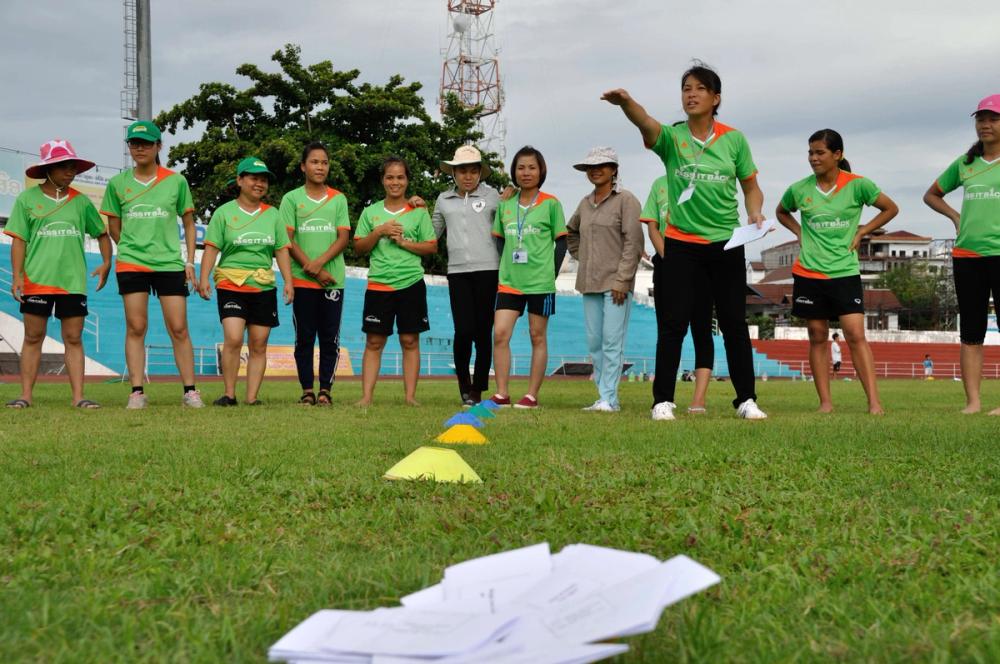 Female rugby coach taking part in training
