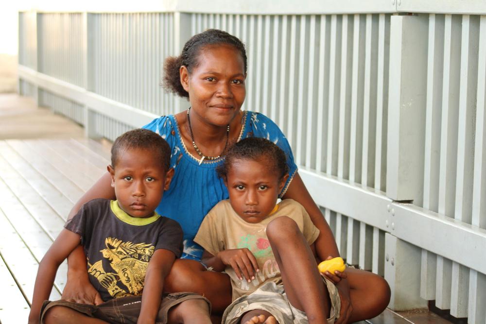 Community health volunteers trained by ChildFund Papua New Guinea have helped Annette and her children, Paul and Michael, survive malaria.