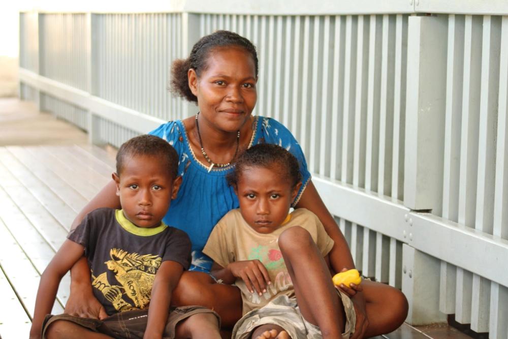 Community health volunteers trained by ChildFund Papua New Guinea have helped Annette and her children, Paul and Michael, survive malaria.