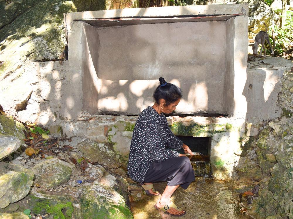 A concrete water tank has bought peace of mind and security to Joanina (pictured above) and her family.