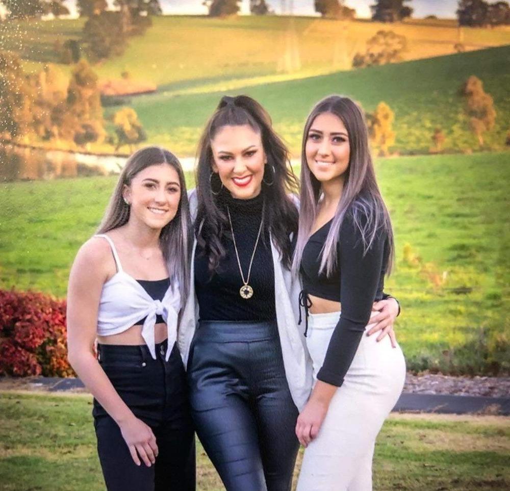 Alarna (pictured in the middle) says sharing the photos and letters from her sponsored children has helped teach her daughters compassion. “They’ve grown up to be good kids, and they’ll come home and tell me stories of how they’ve helped someone.”