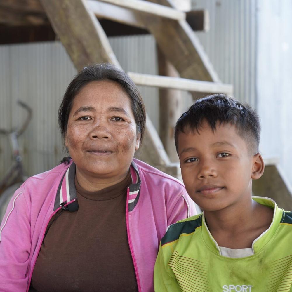 Piseth and his mum at a community-based learning class in their community 