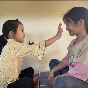 Lan and her younger sister playing.