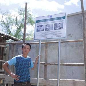 Song next to a water tank.