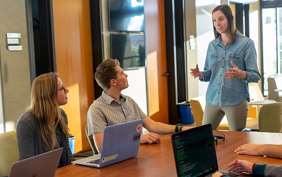 Team working together on security in Agile software development project. Photo from Clayton Cardinalli on Unsplash.