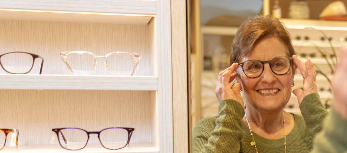 SuperGold - A senior out shopping for spectacles