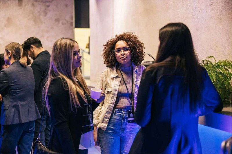 Ladies meeting at a networking event.