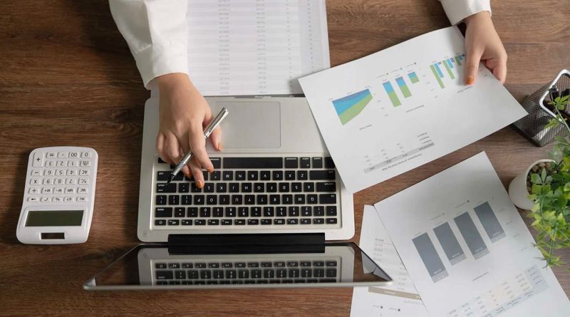 Aerial view of construction staff member working on a bid for a construction project. 