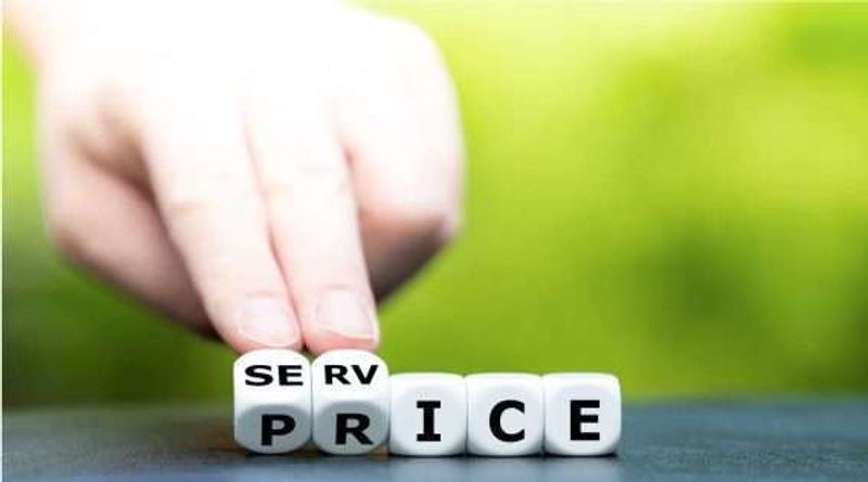 Cubes being used to spell out the word price and service.