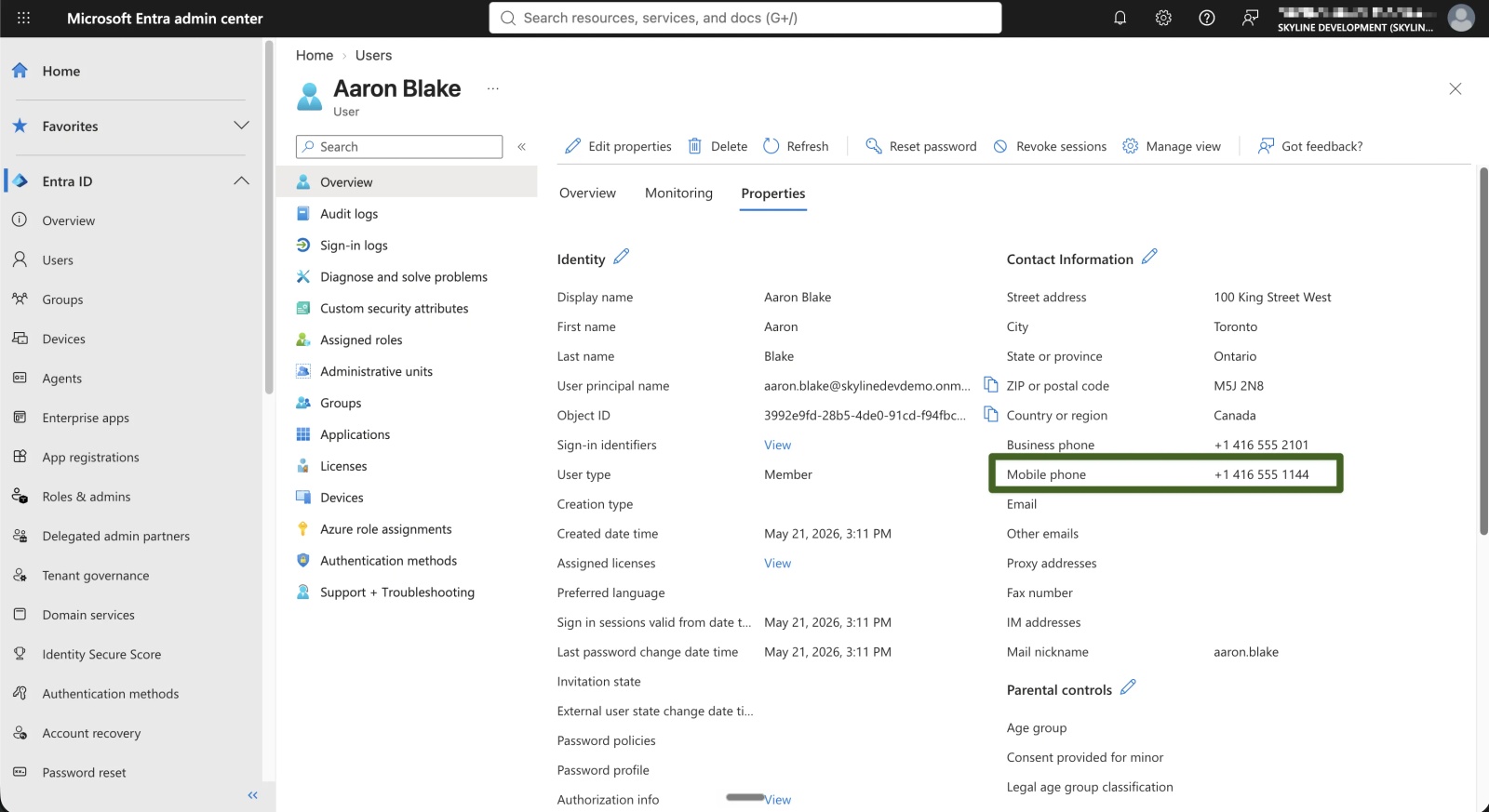 Entra user properties for Aaron Blake with the Mobile phone field, +1 416 555 1144, highlighted under Contact Information.