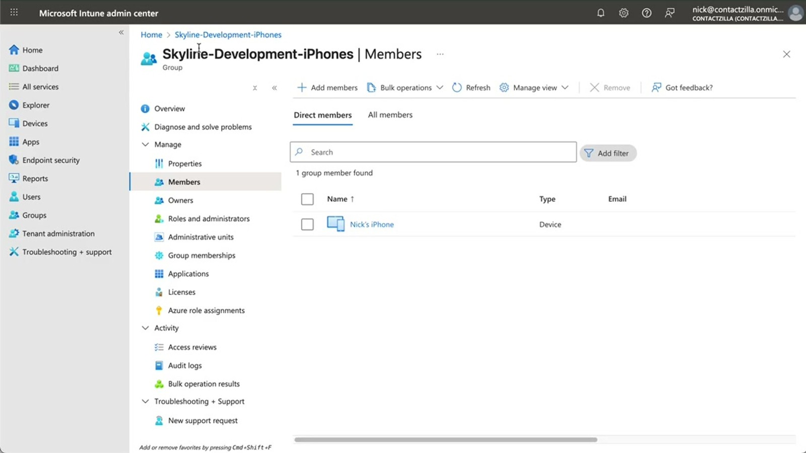 Microsoft Intune admin center showing an iOS device group with enrolled iPhones