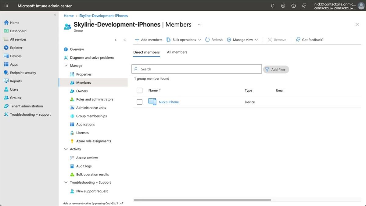 Microsoft Intune admin center showing an iOS device group with enrolled iPhones