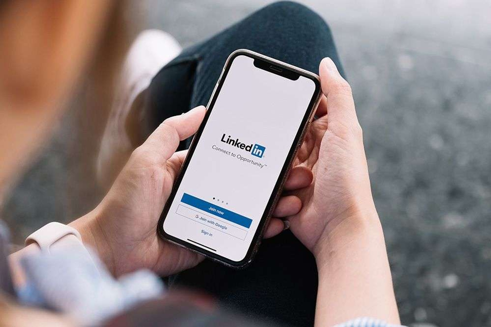 Person using LinkedIn on their phone.