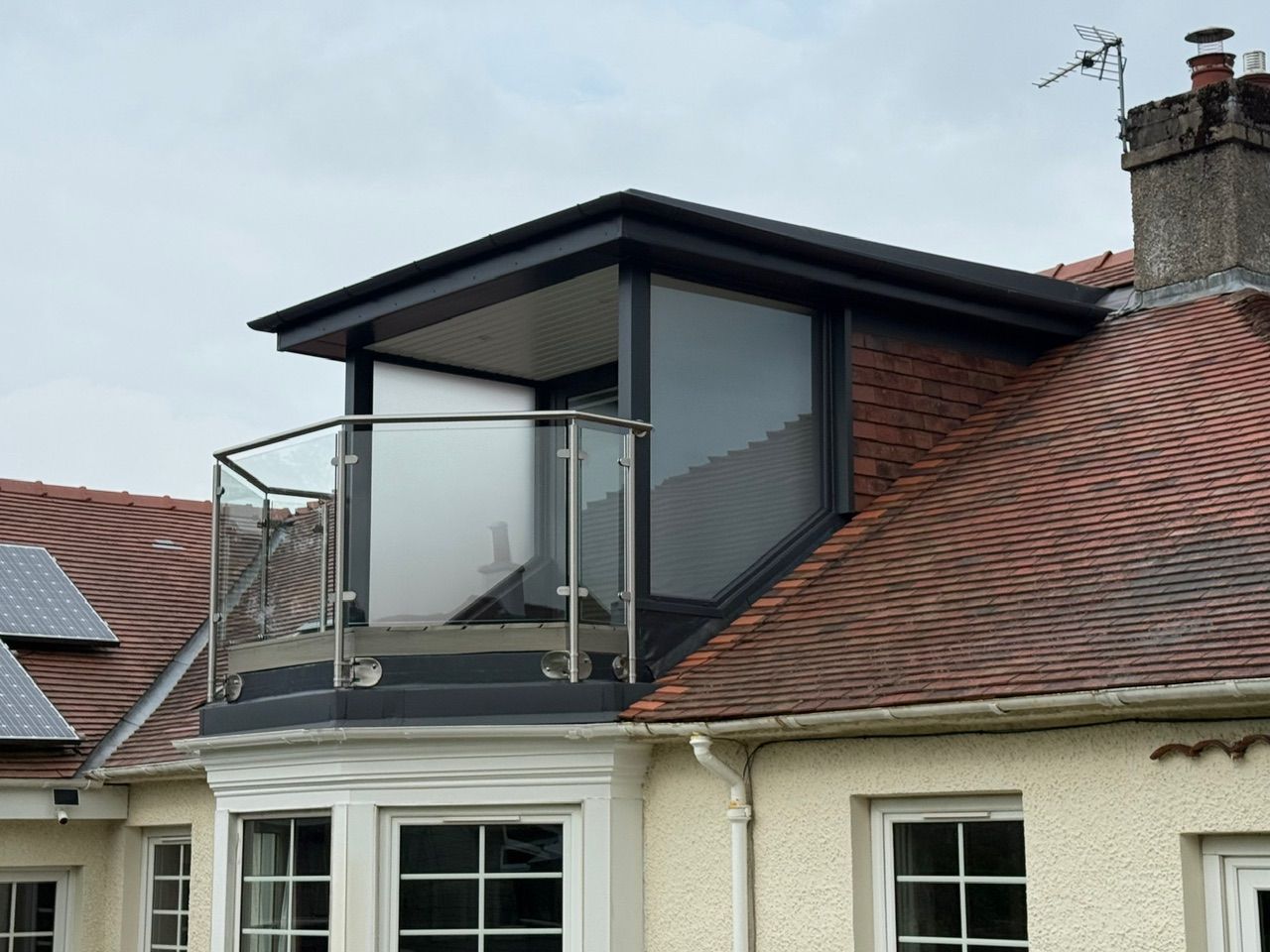 Side view of the finished dormer, balcony and tiled roof at Fernielaw Avenue