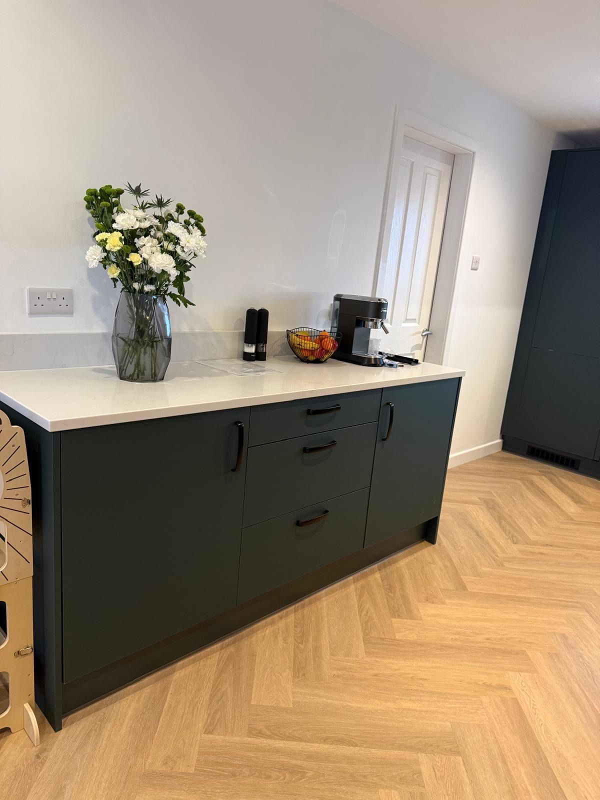Tranent kitchen refurbishment showing green cabinetry, white worktops and fitted sink
