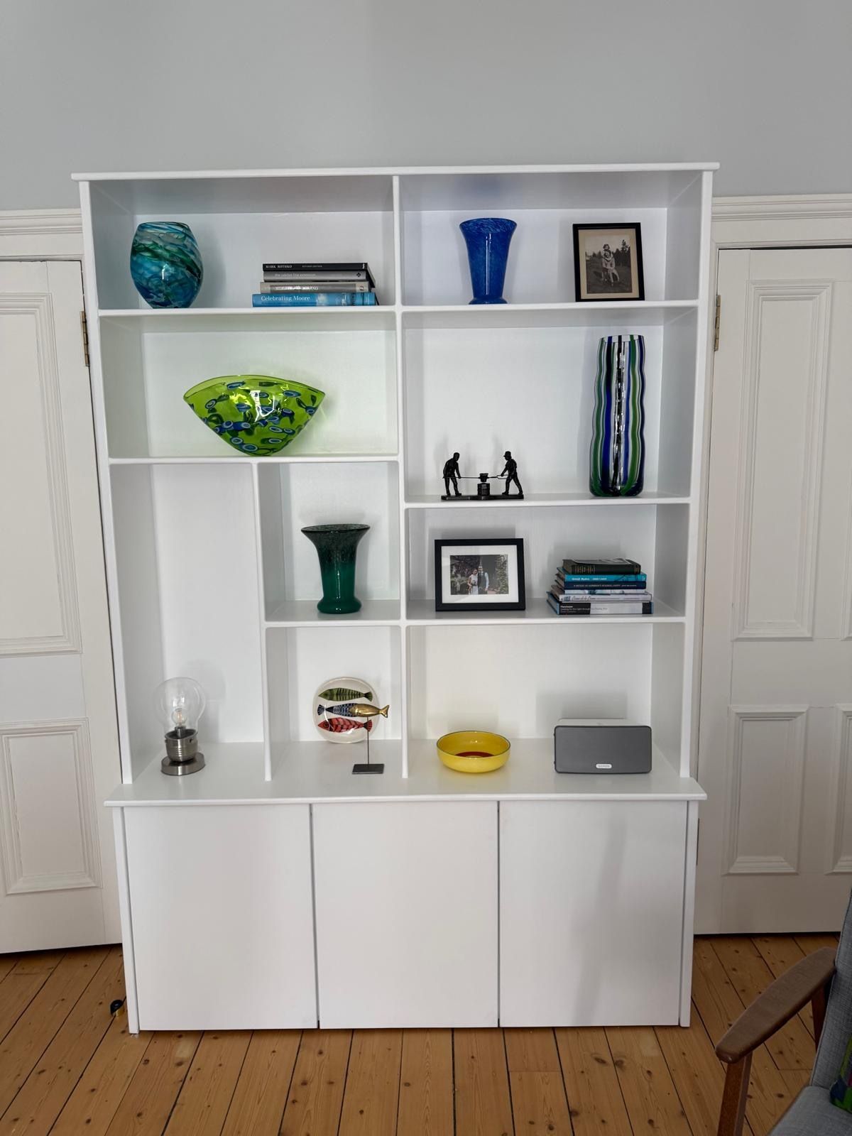 Finished bespoke unit with display shelves, cupboard storage and period room details