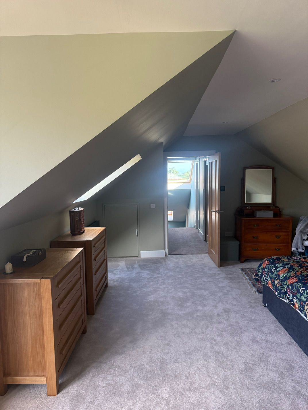 Completed loft bedroom beneath the sloping roof at Fernielaw Avenue