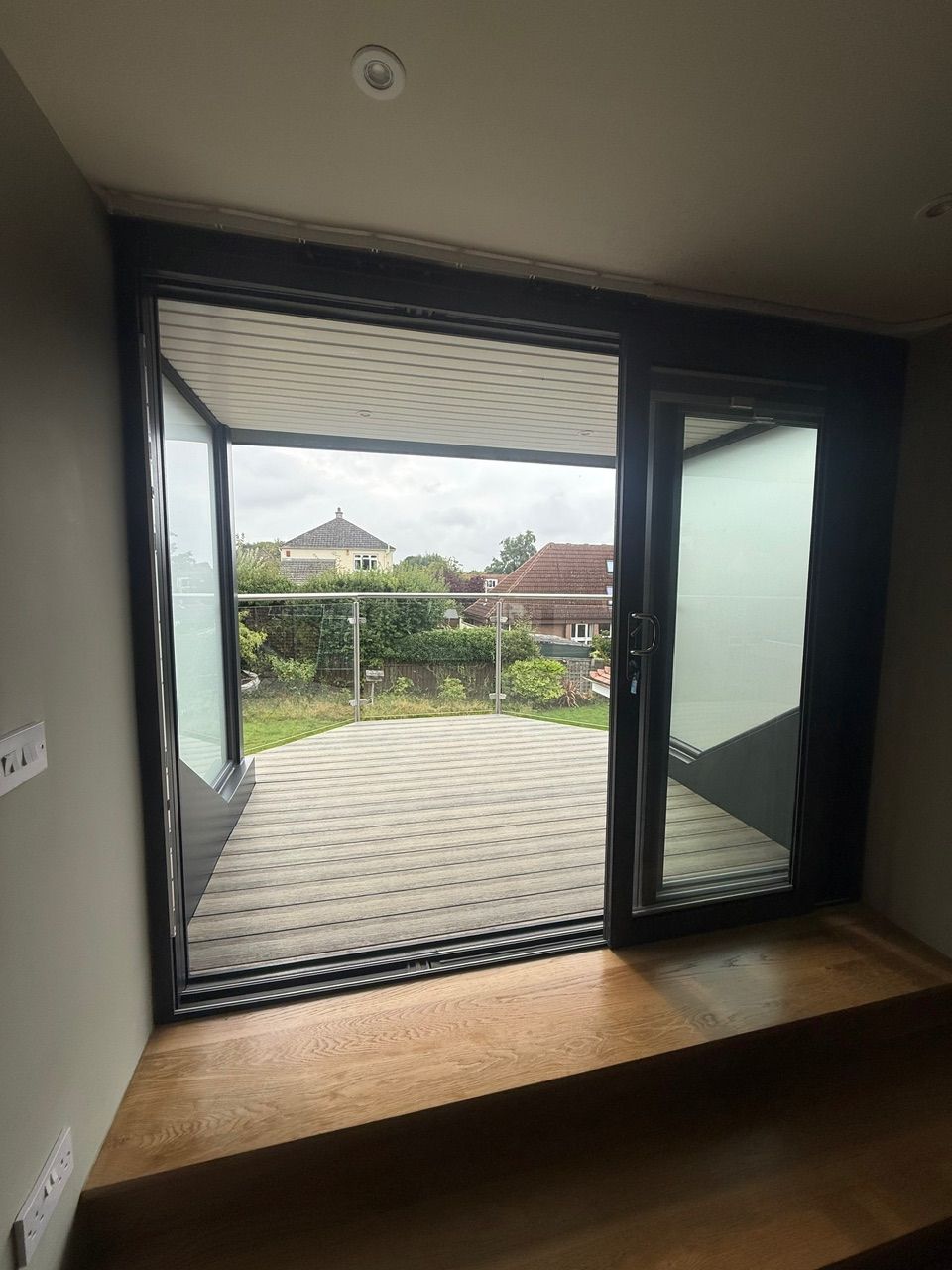 Open patio doors leading onto the decked balcony at Fernielaw Avenue