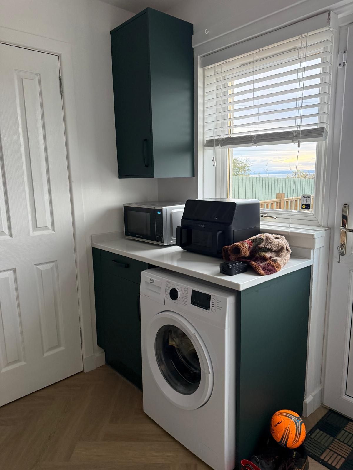 Detail of the finished kitchen flooring and cabinet installation in Tranent