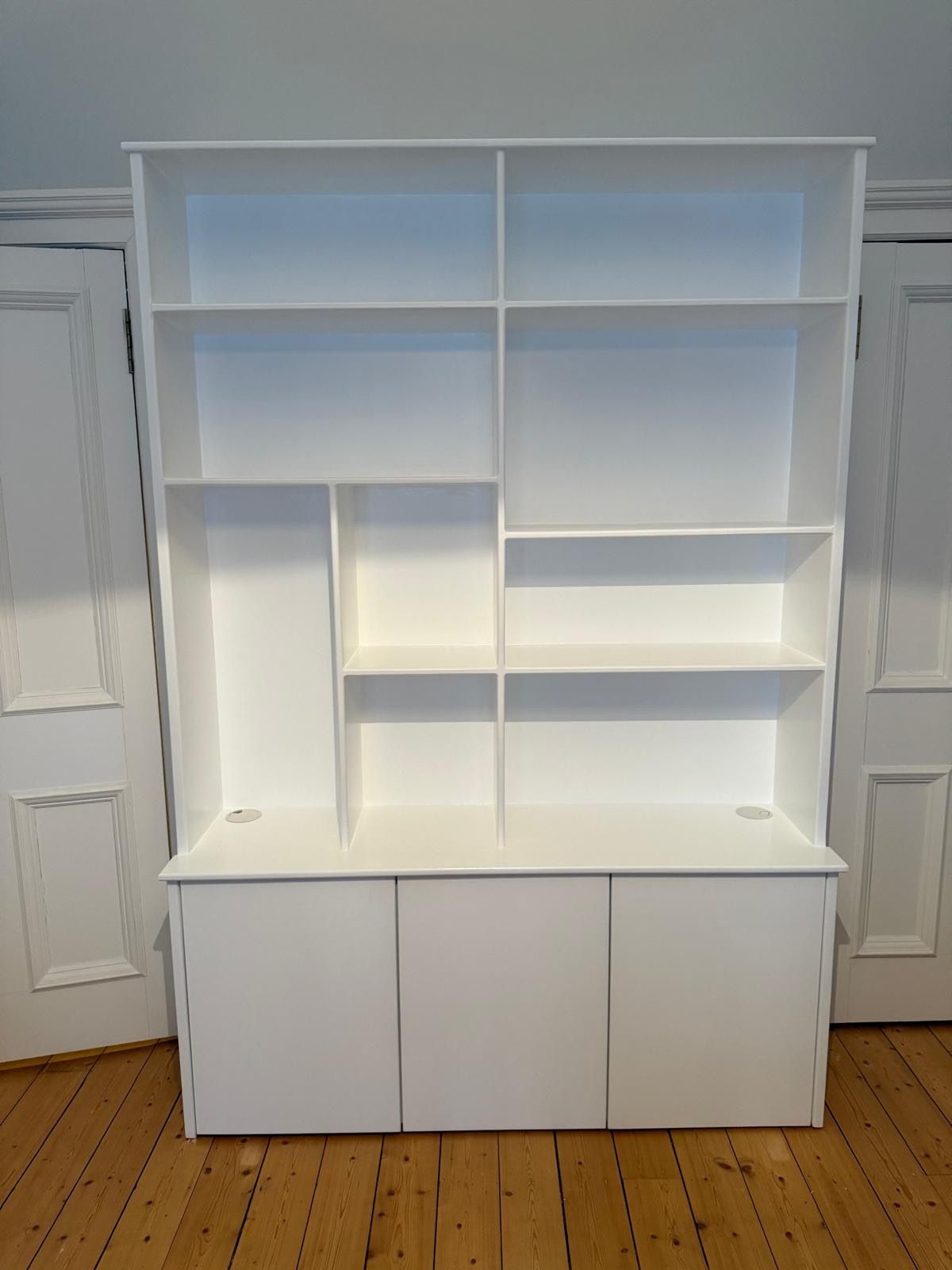 Detail view of the made-to-measure display shelves and storage cupboards