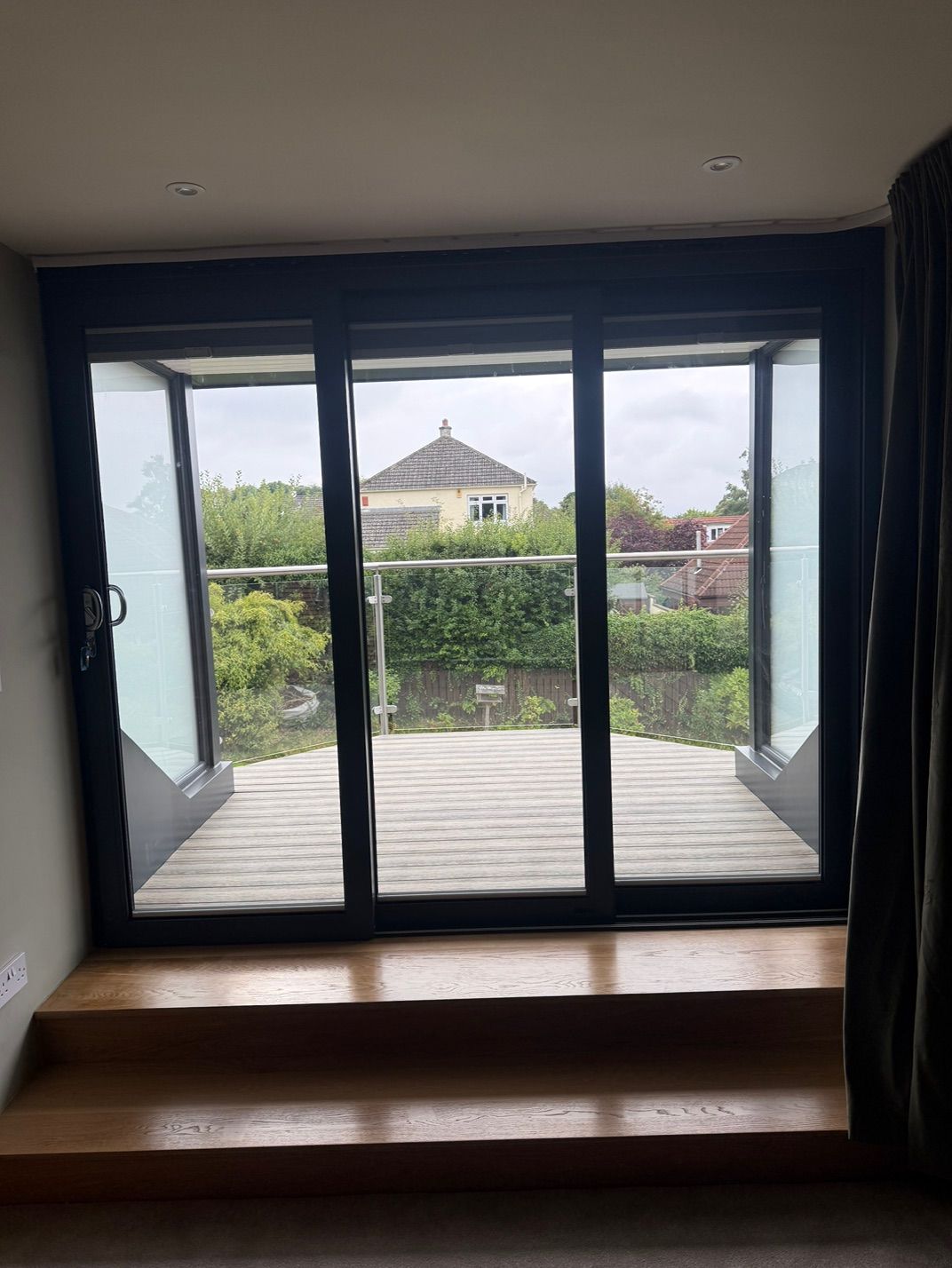 Timber steps leading up to the patio doors and balcony at Fernielaw Avenue