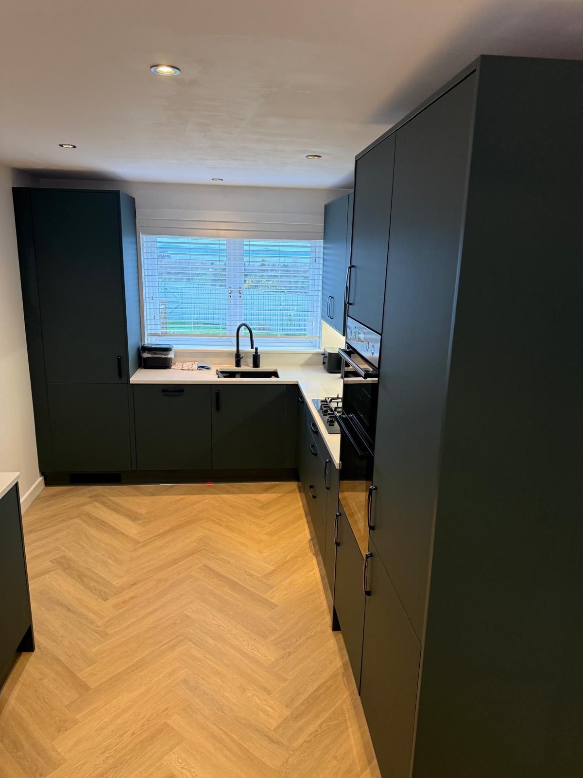 Completed downstairs herringbone vinyl flooring as part of the Tranent refurbishment