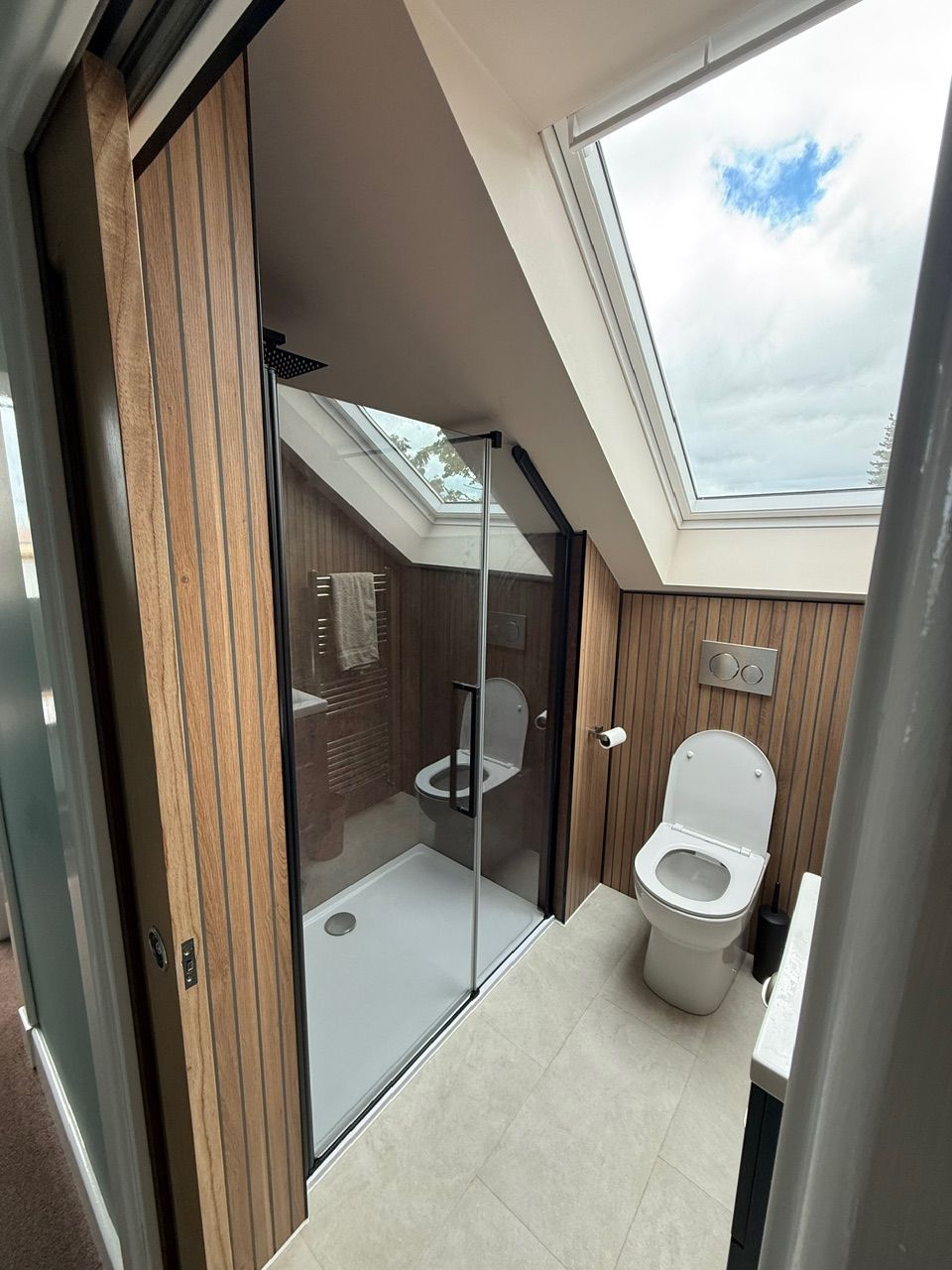 Loft bathroom with glazed shower and rooflight at Fernielaw Avenue
