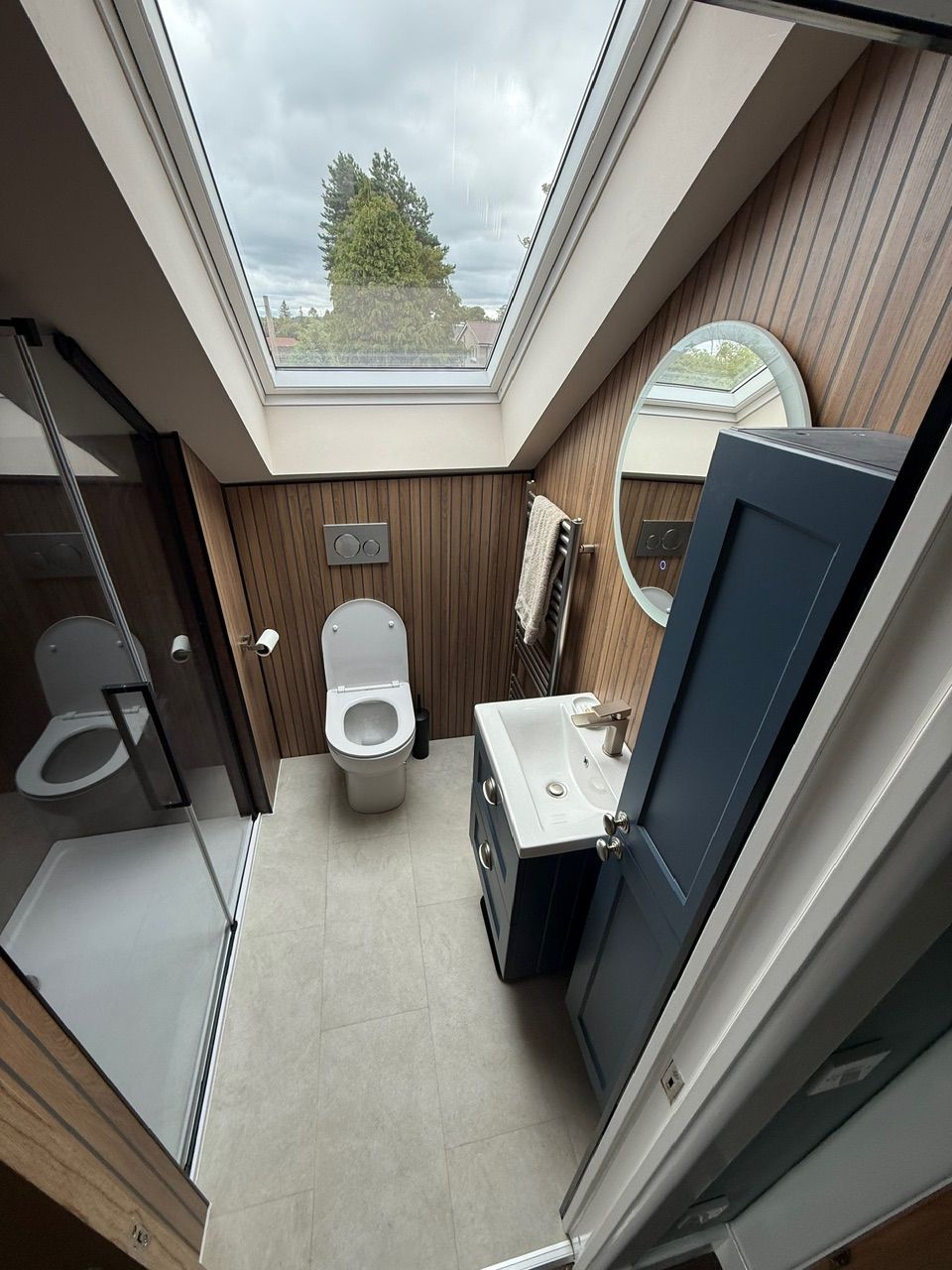 Completed loft bathroom with rooflight, toilet and vanity unit at Fernielaw Avenue
