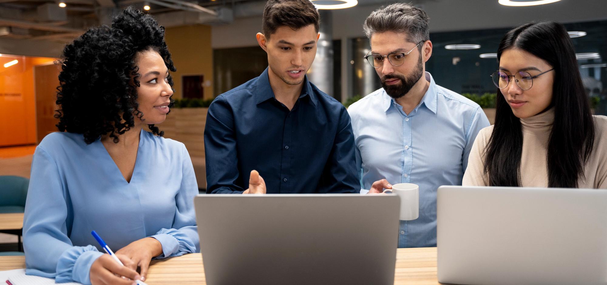 Team reviewing action items and next steps after a conversation, planning scheduling and proposal submission.