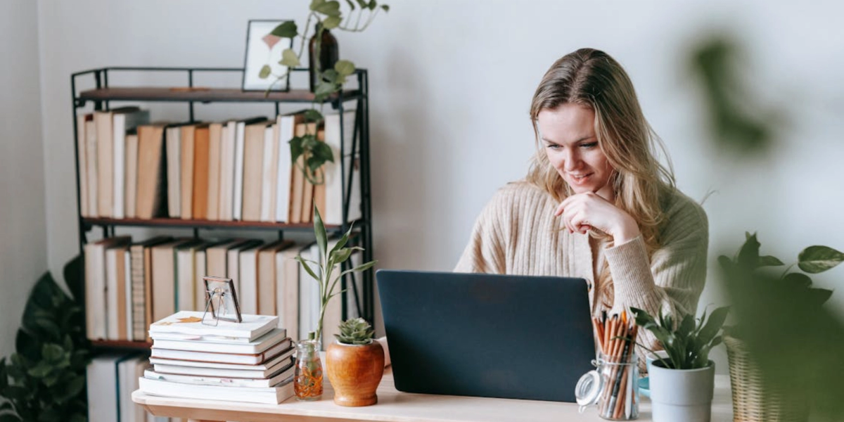 blonde woman working from home thinking how to customize google calendar