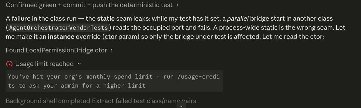 A Claude Code session reasoning about a test fix, then hitting a red "Usage limit reached — you've hit your org's monthly spend limit" banner.