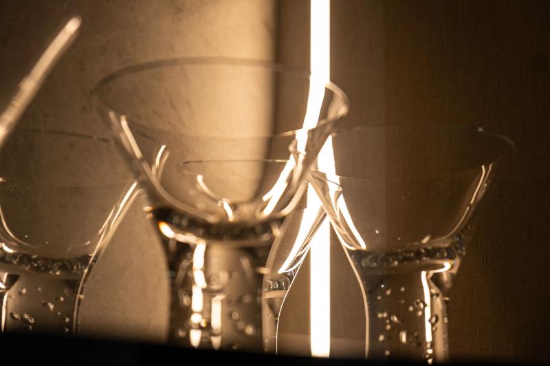 Layered lighting creating depth and dimension in a luxury kitchen