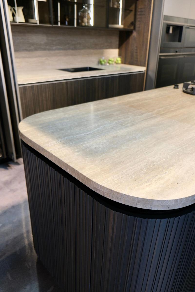 Sculptural island with dramatic stone veining
