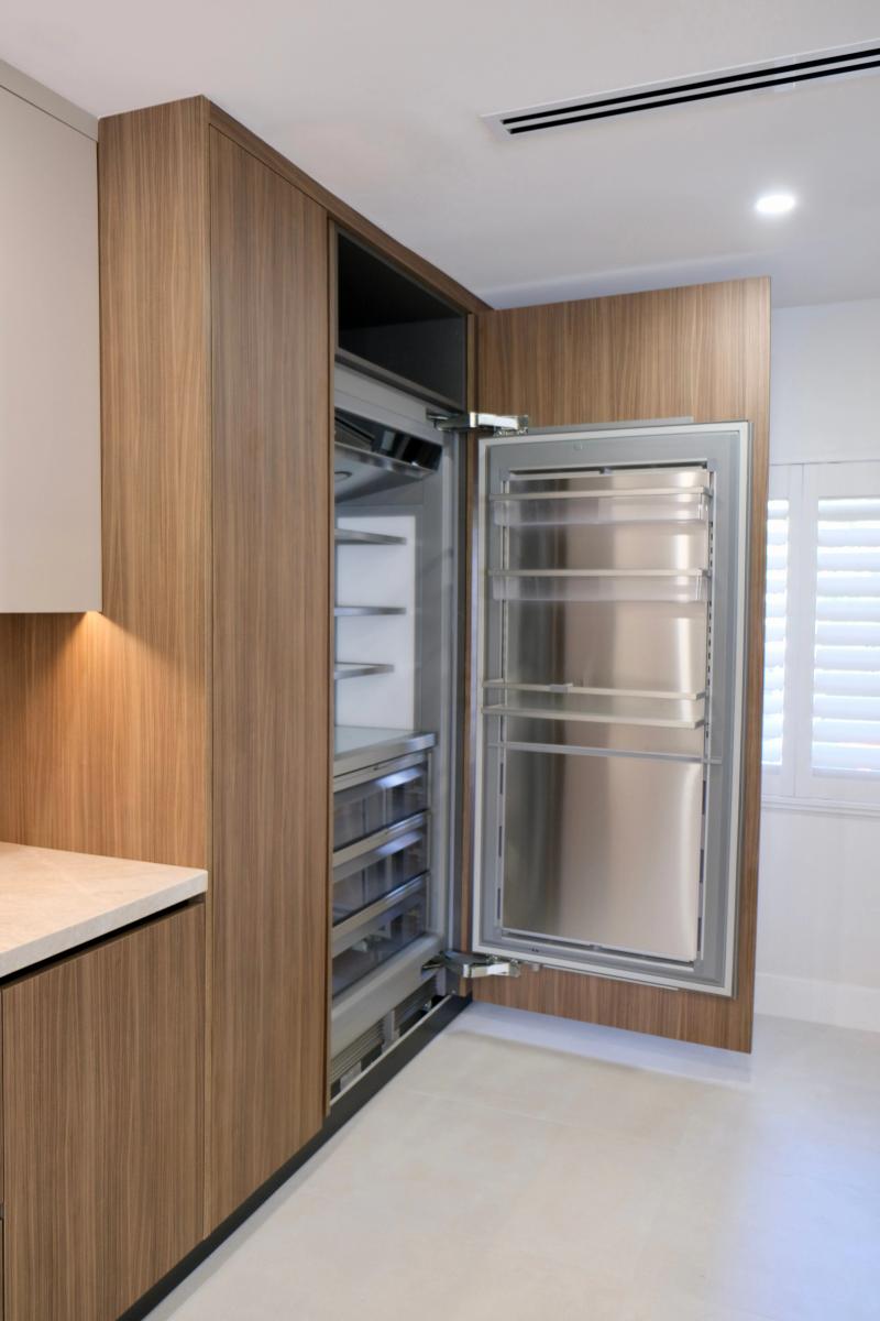 Seamless panel-ready refrigeration blending into cabinetry