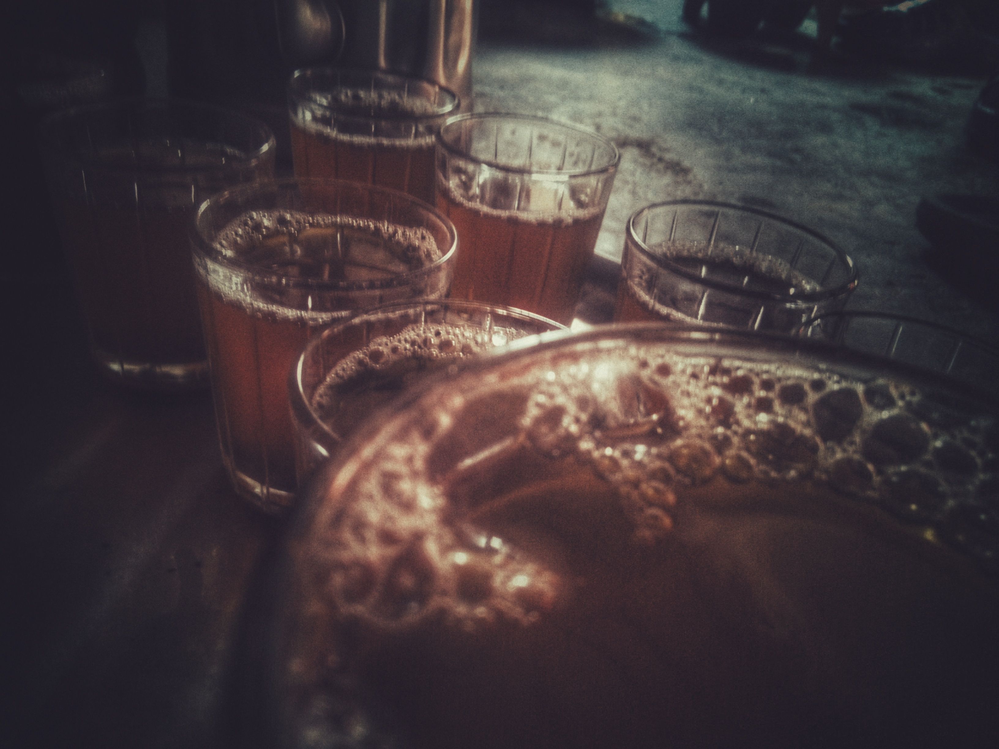 Glasses of frothy tea on a tray