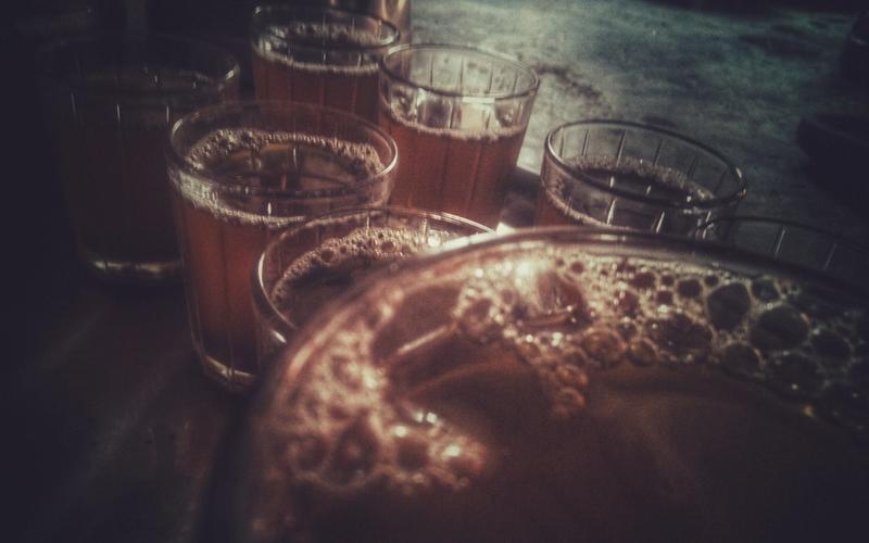 Glasses of frothy tea on a tray