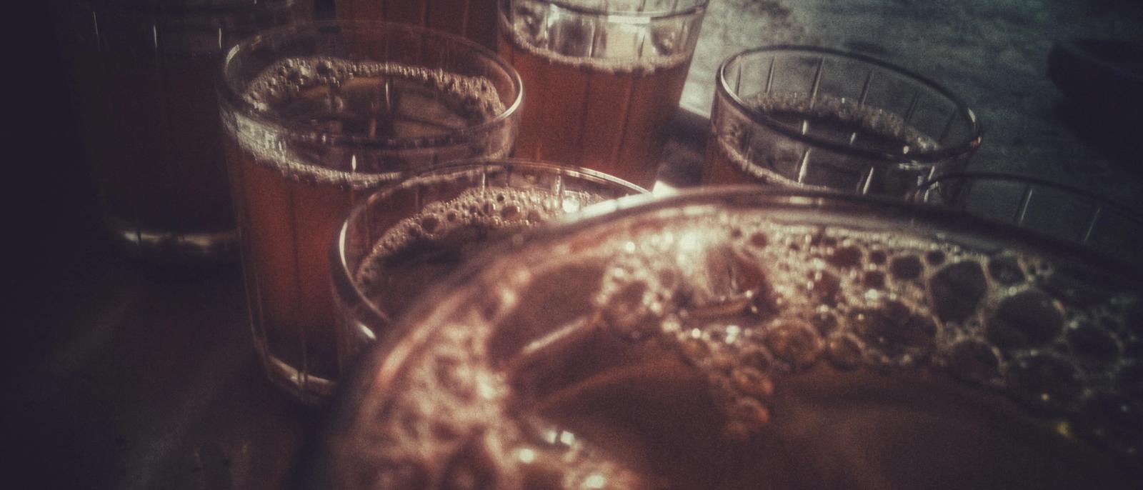 Glasses of frothy tea on a tray