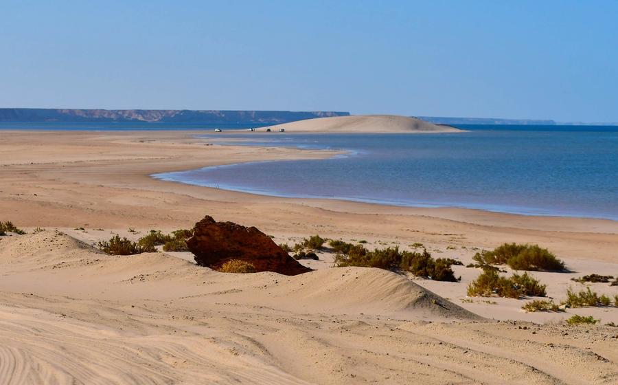The pale White Dune rising from the edge of the Dakhla lagoon