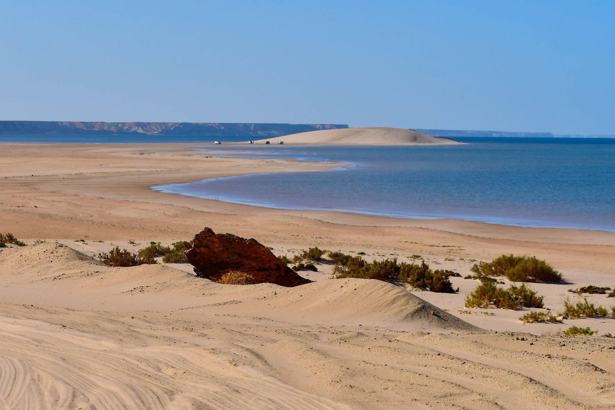 The pale White Dune rising from the edge of the Dakhla lagoon