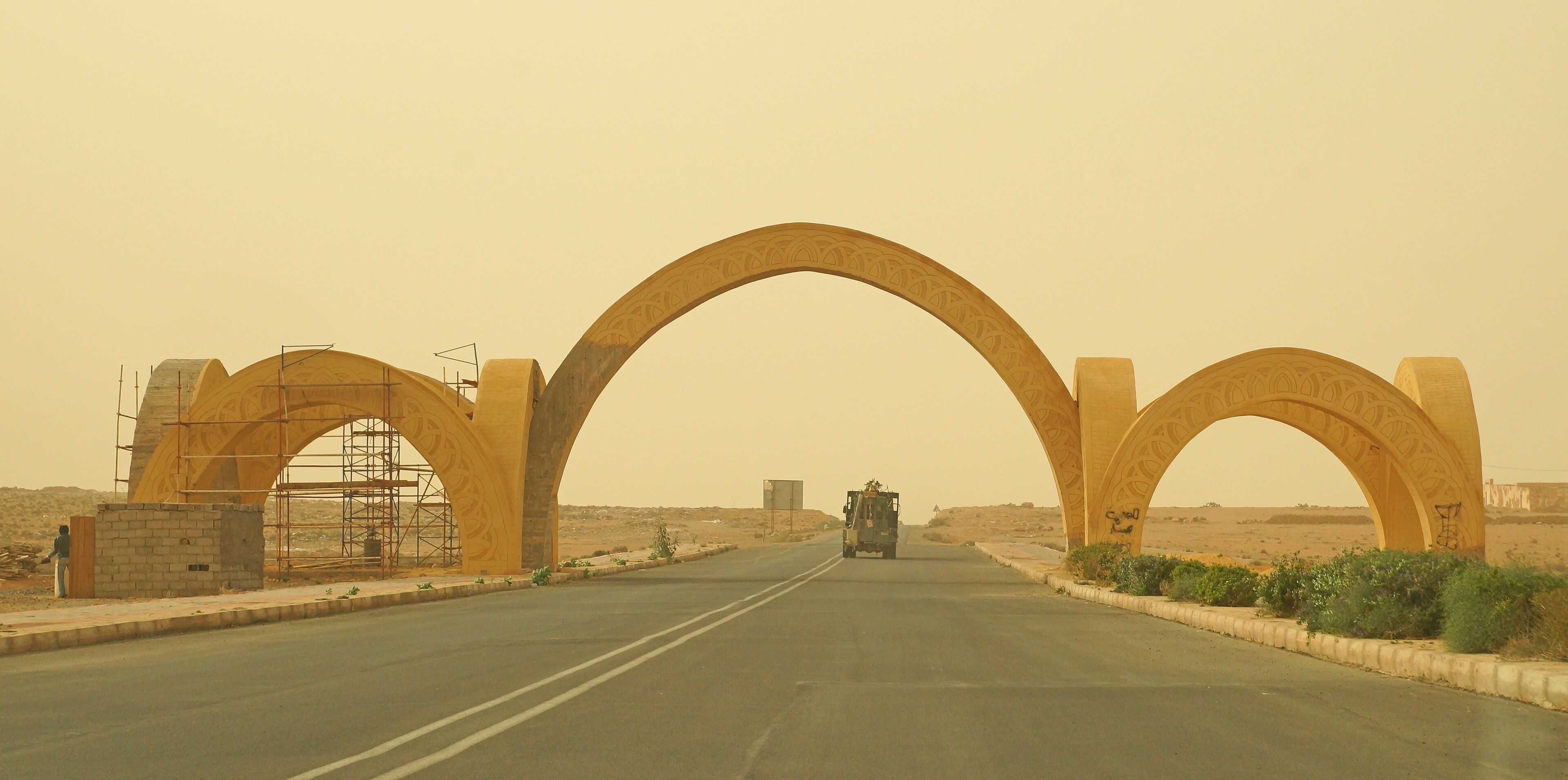 The arched western gate on the road into Guelmim