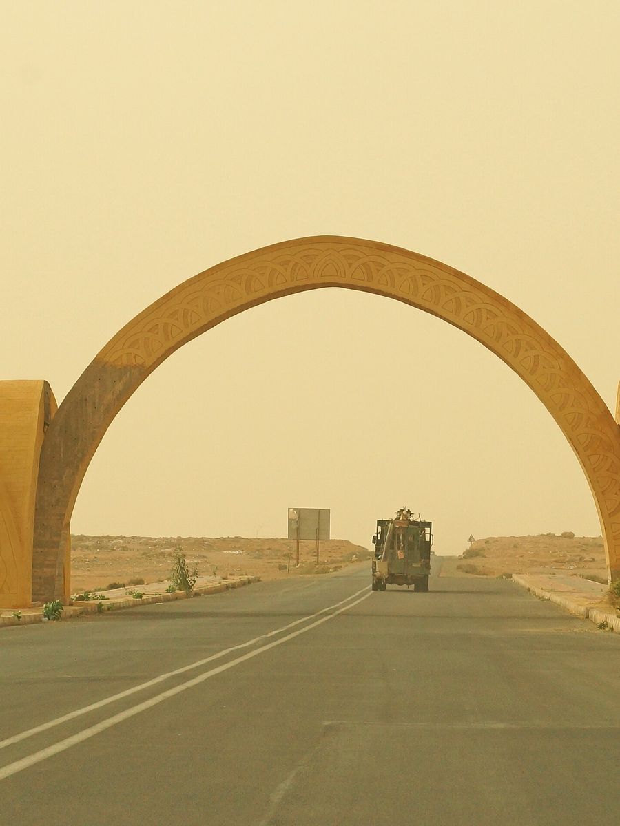 The arched western gate on the road into Guelmim